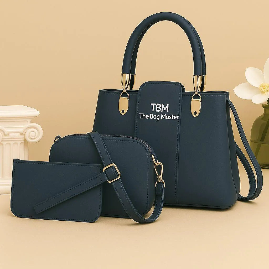 Navy blue handbag with matching pouch on a beige background, featuring 'TBM The Bag Master' branding.