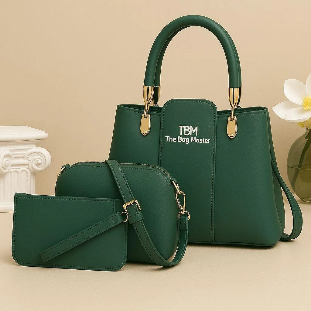 Green handbag and matching pouch with 'TBM The Bag Master' branding on a beige background.