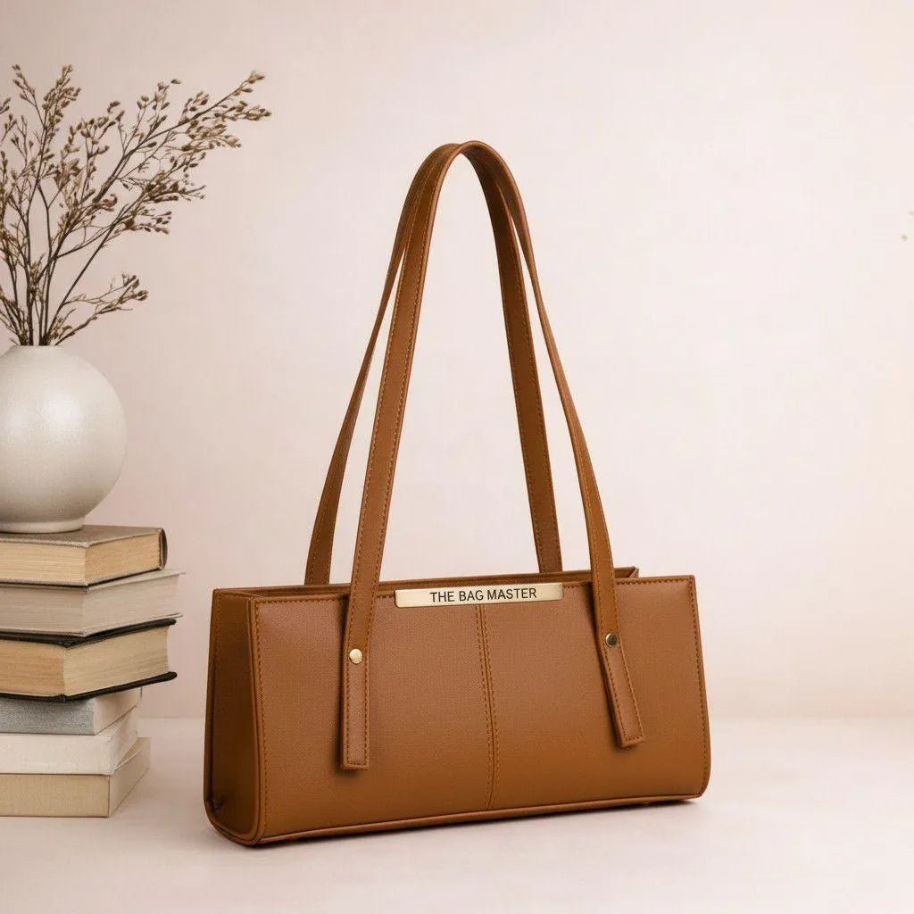 Brown handbag with 'The Bag Master' branding on a light background