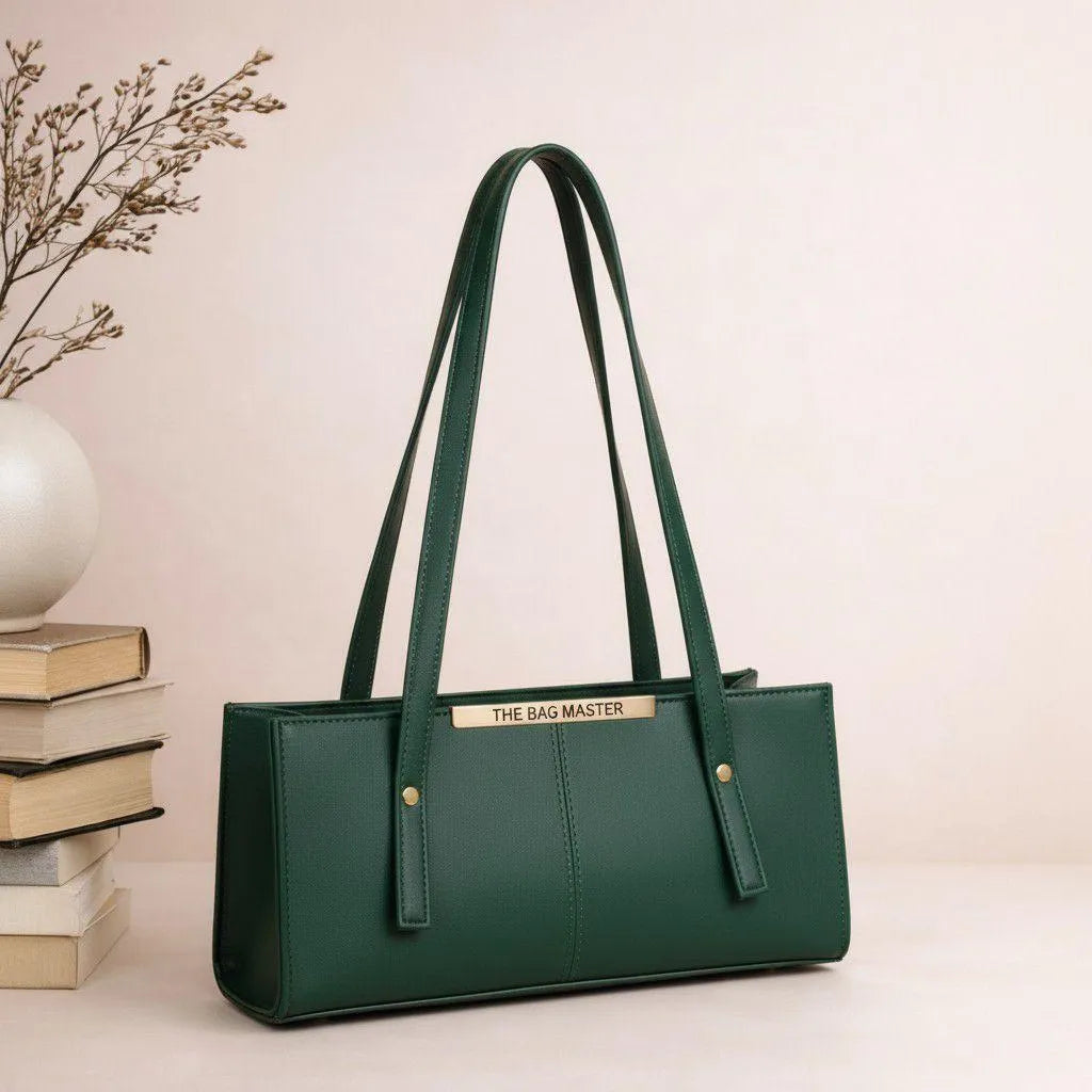 Green handbag with 'The Bag Master' branding on a light background