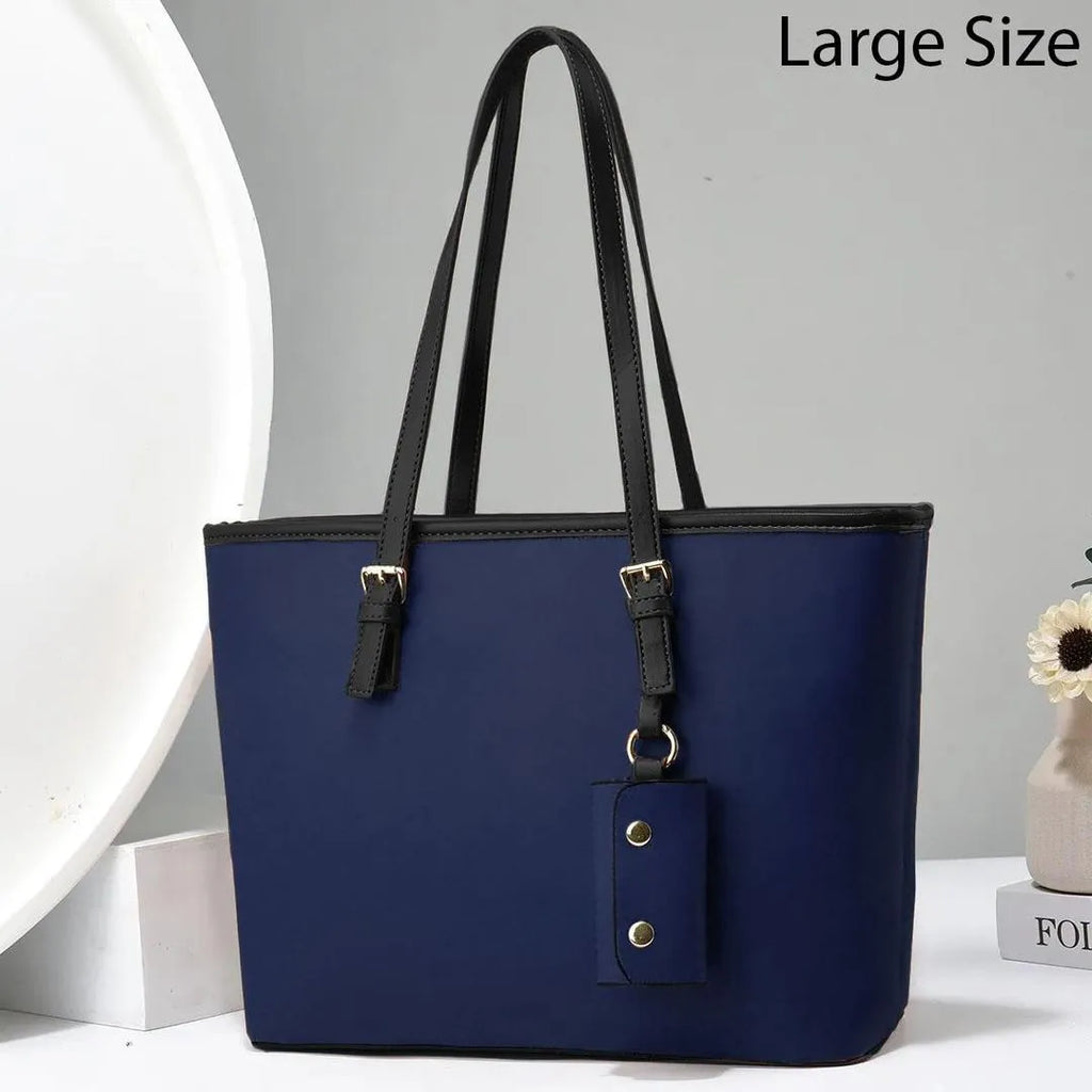Blue handbag with black straps on a white background
