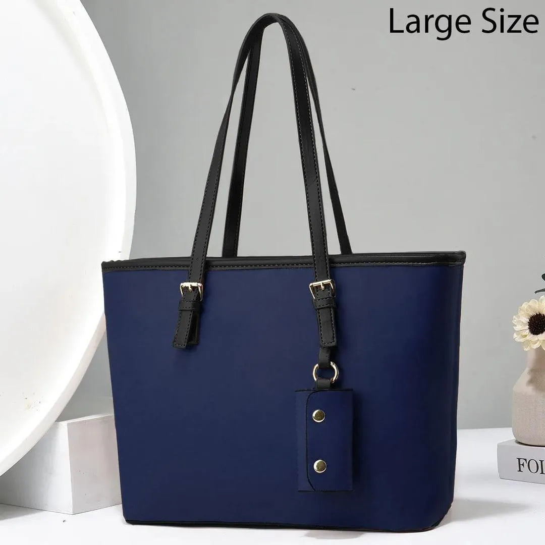 Blue handbag with black straps on a white background
