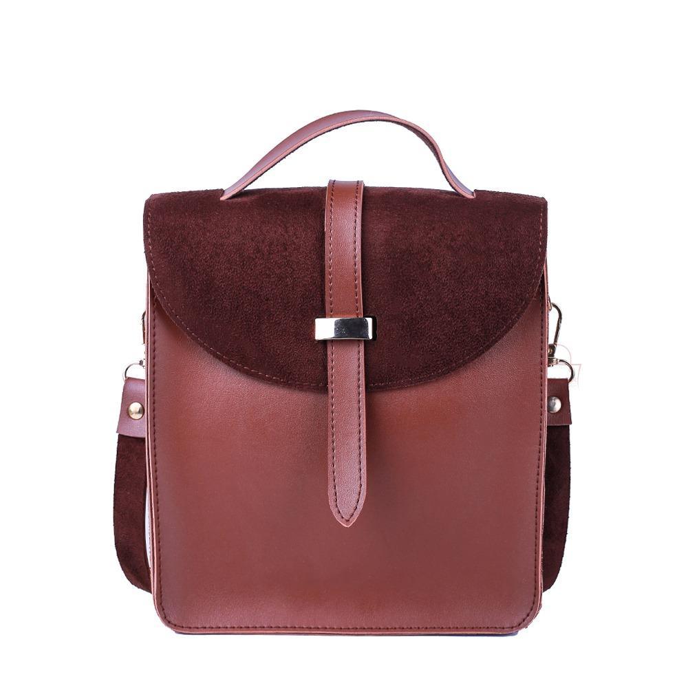 Brown leather backpack with a buckle on a white background