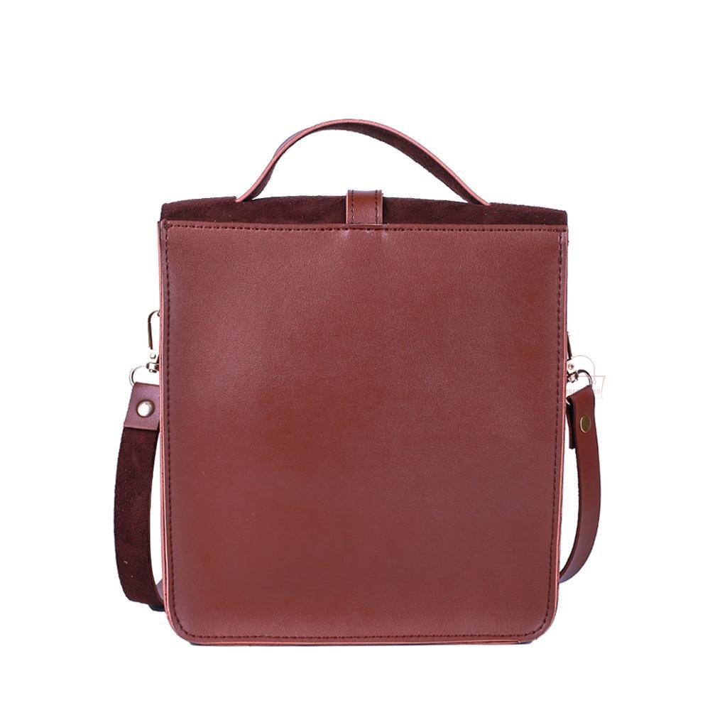 Brown leather crossbody bag on a white background